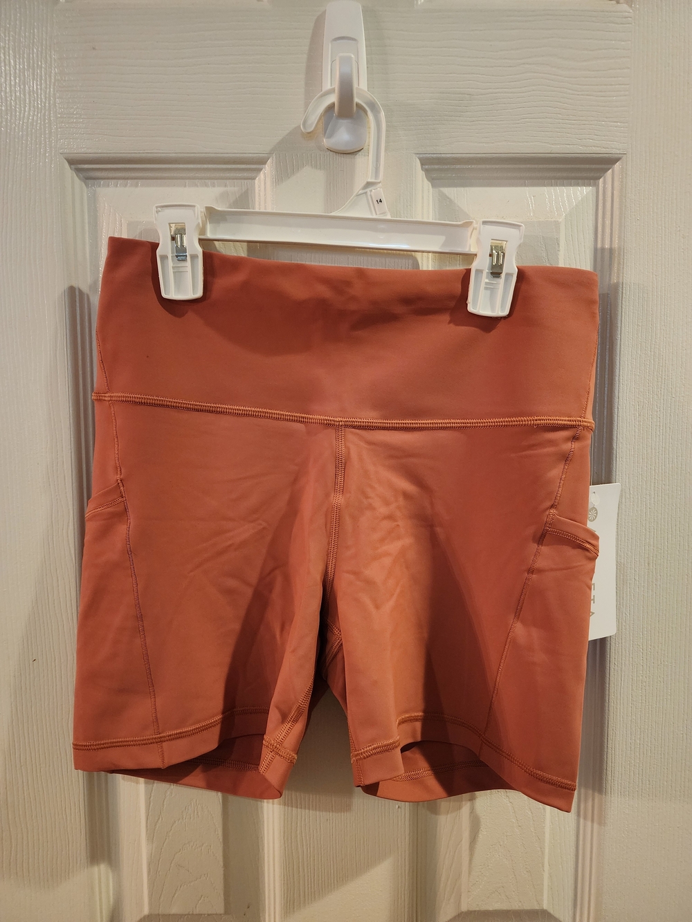 Athleta Rust-Orange High-Rise Bike Shorts with Side Pockets